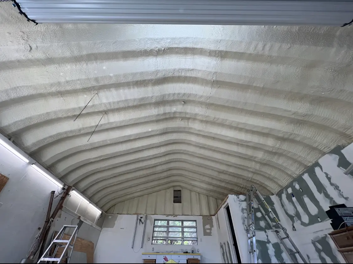 Spray polyurethane foam applied to the underside of a metal roof deck in River Edge